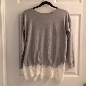 Grey sweater with lace underlay